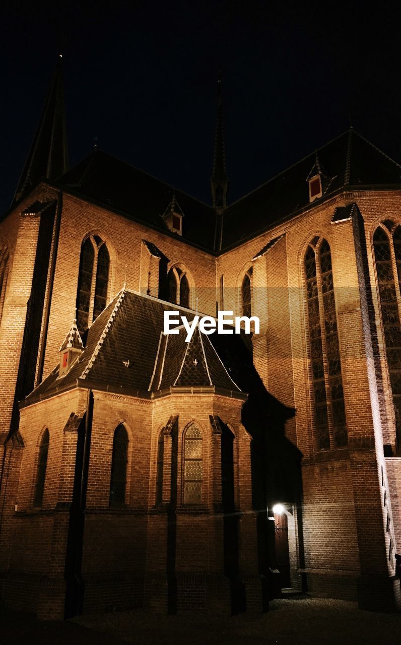 LOW ANGLE VIEW OF CHURCH AT NIGHT