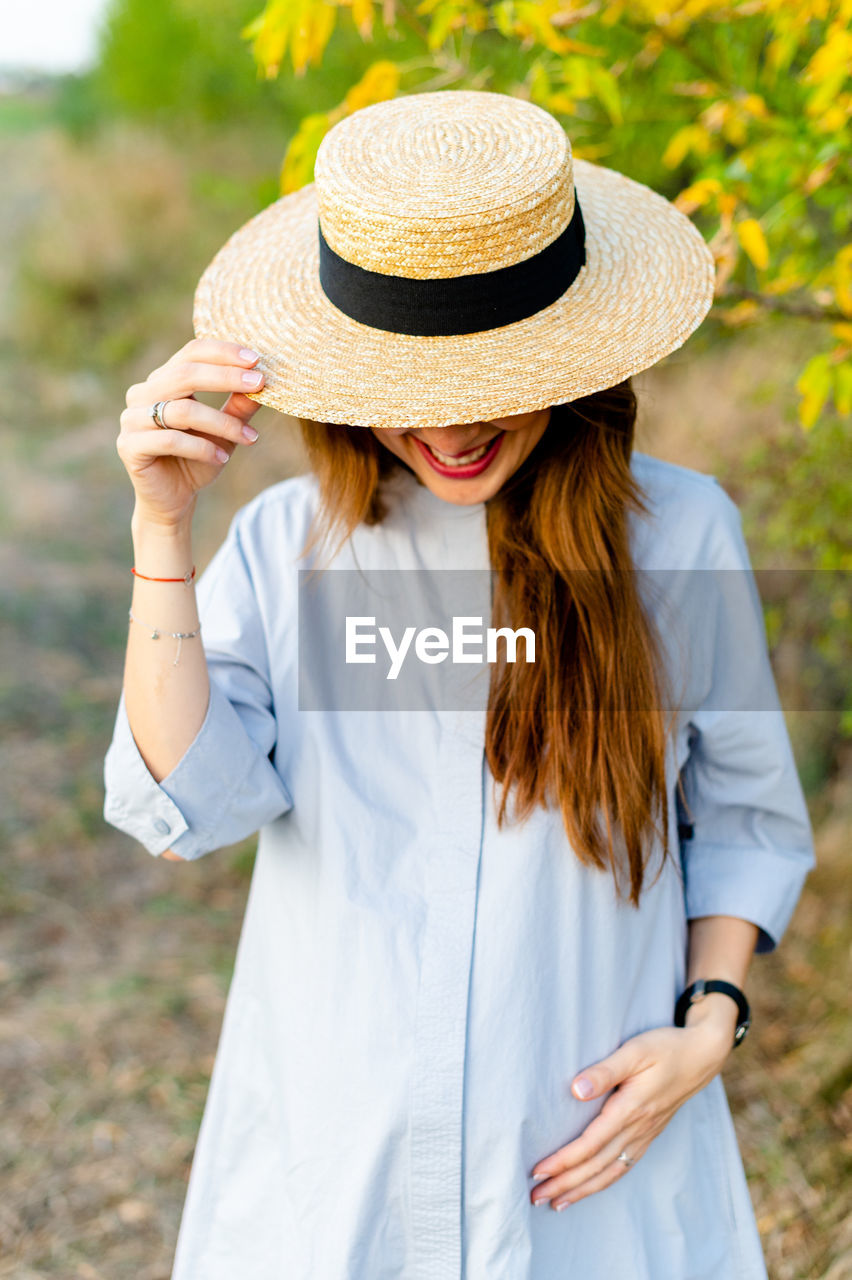 WOMAN WEARING HAT