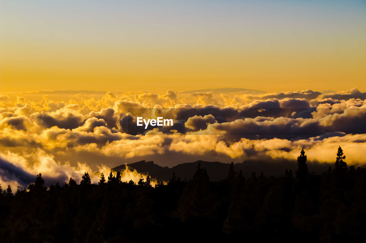 Scenic view of dramatic sky during sunset