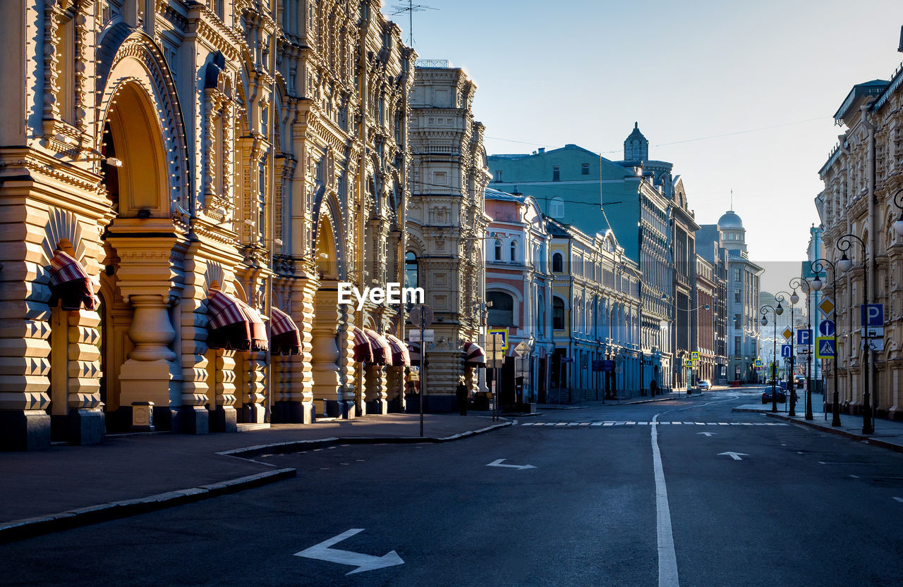 Street amidst buildings against sky in city