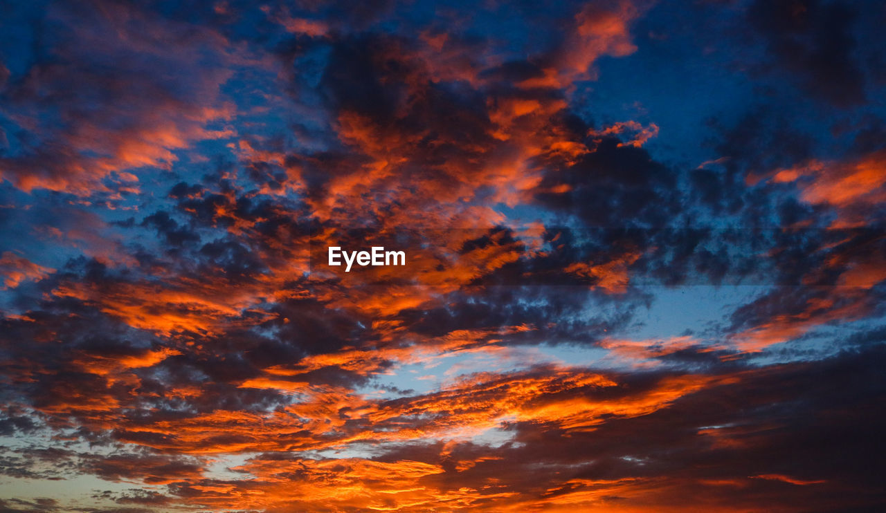 Low angle view of dramatic sky during sunset