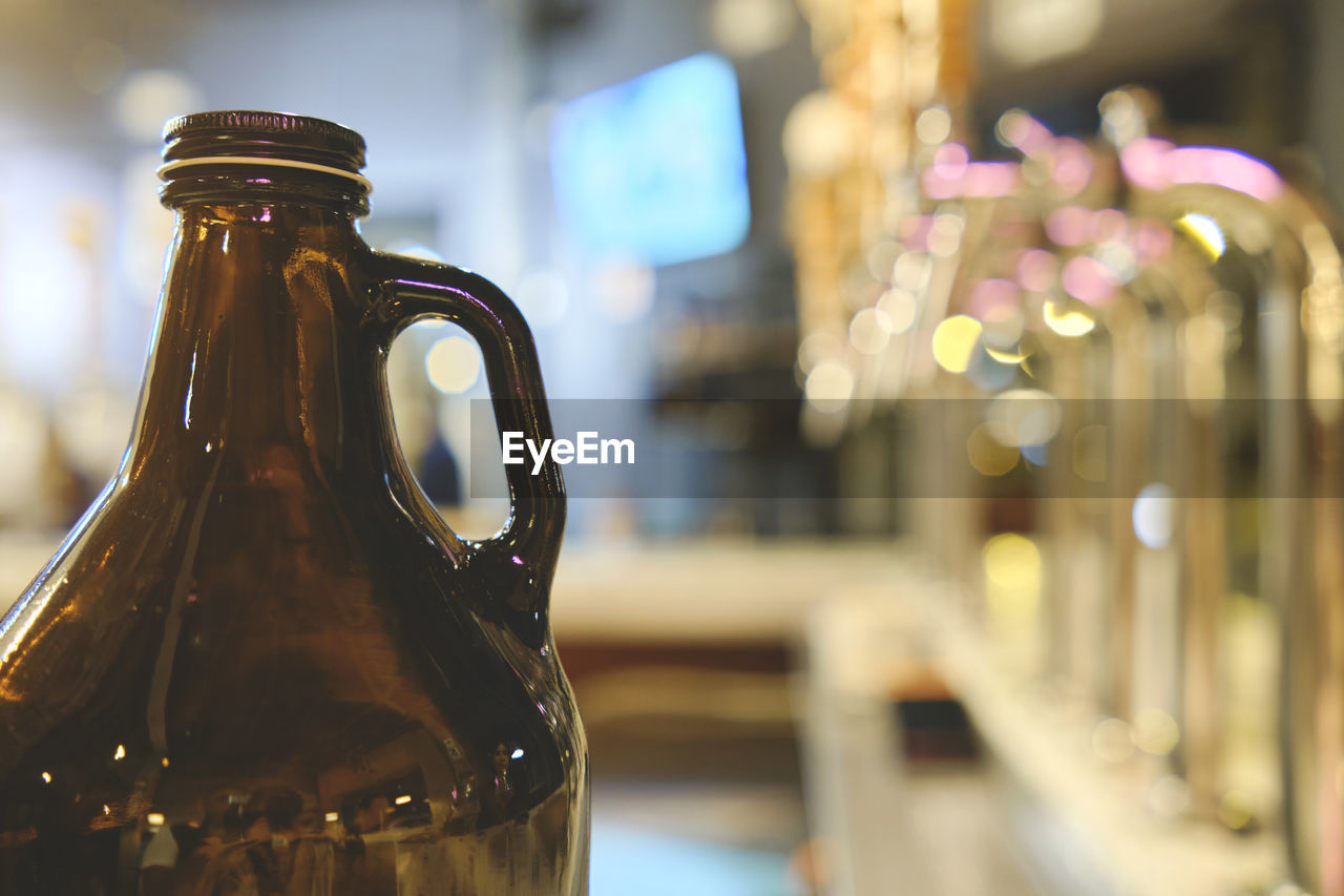 Bottle beer and micro brew or draft beer taps, row of draft beer taps at a bar. selective focus. 