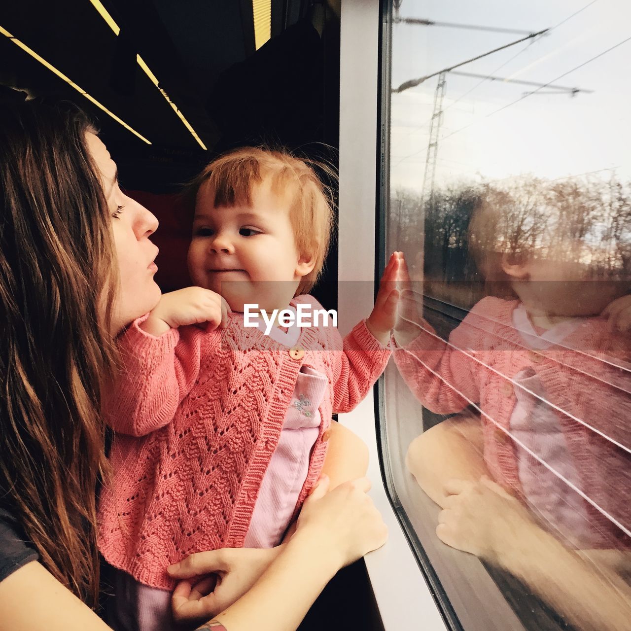 Baby with mother in train