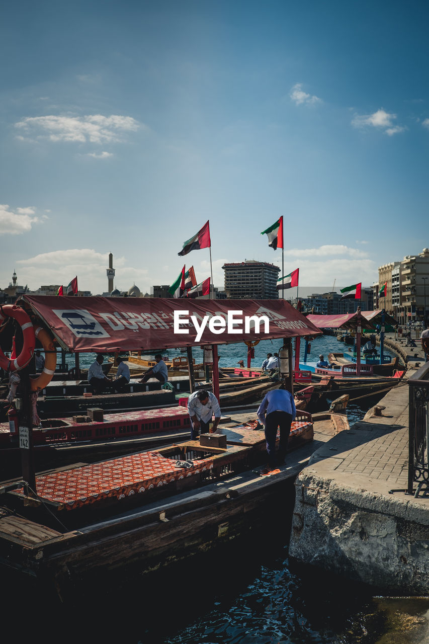 VIEW OF FLAGS HANGING IN CITY