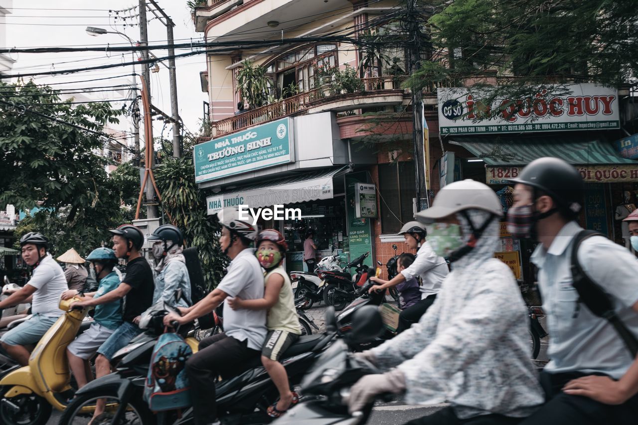 GROUP OF PEOPLE ON STREET