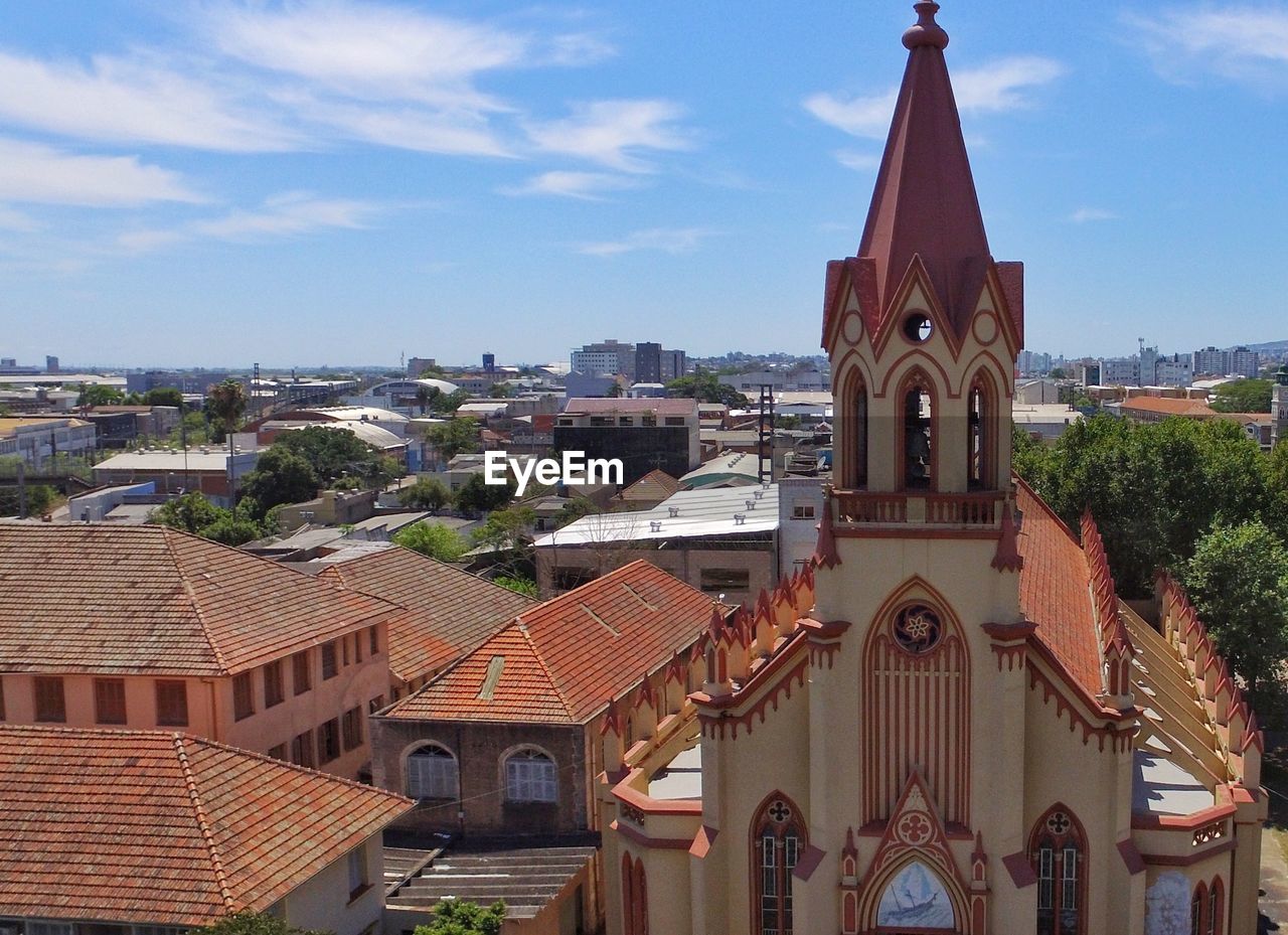 View of buildings in city against sky