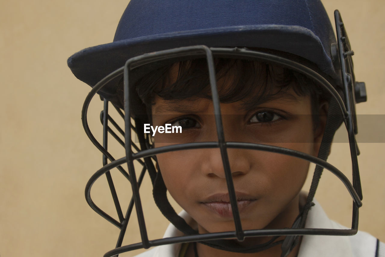 CLOSE-UP PORTRAIT OF BOY WITH HAT