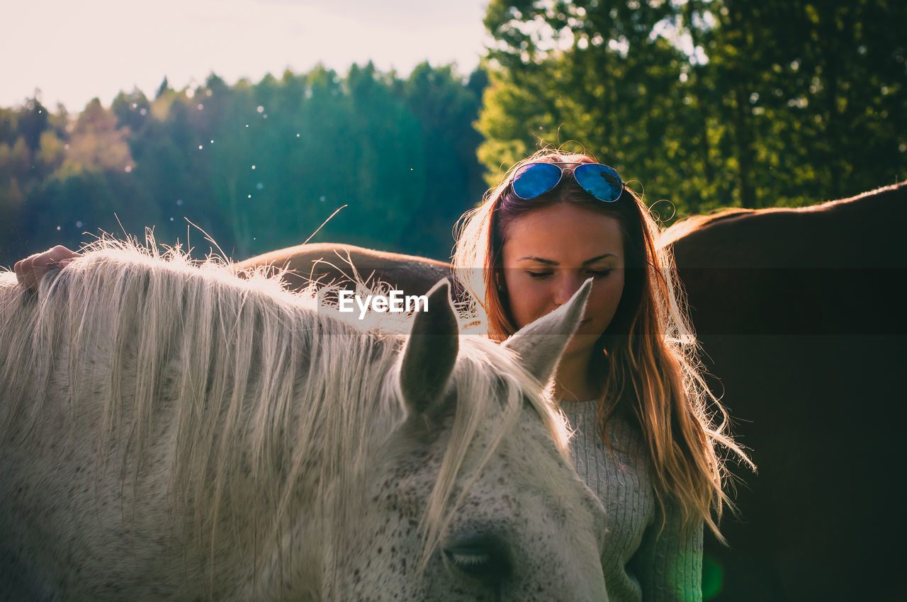 Young woman with horses