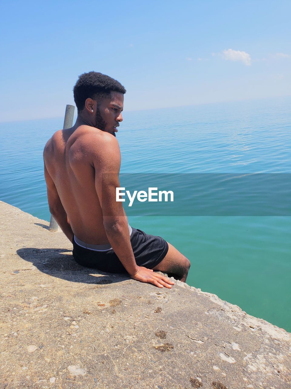 Man looking at sea against sky