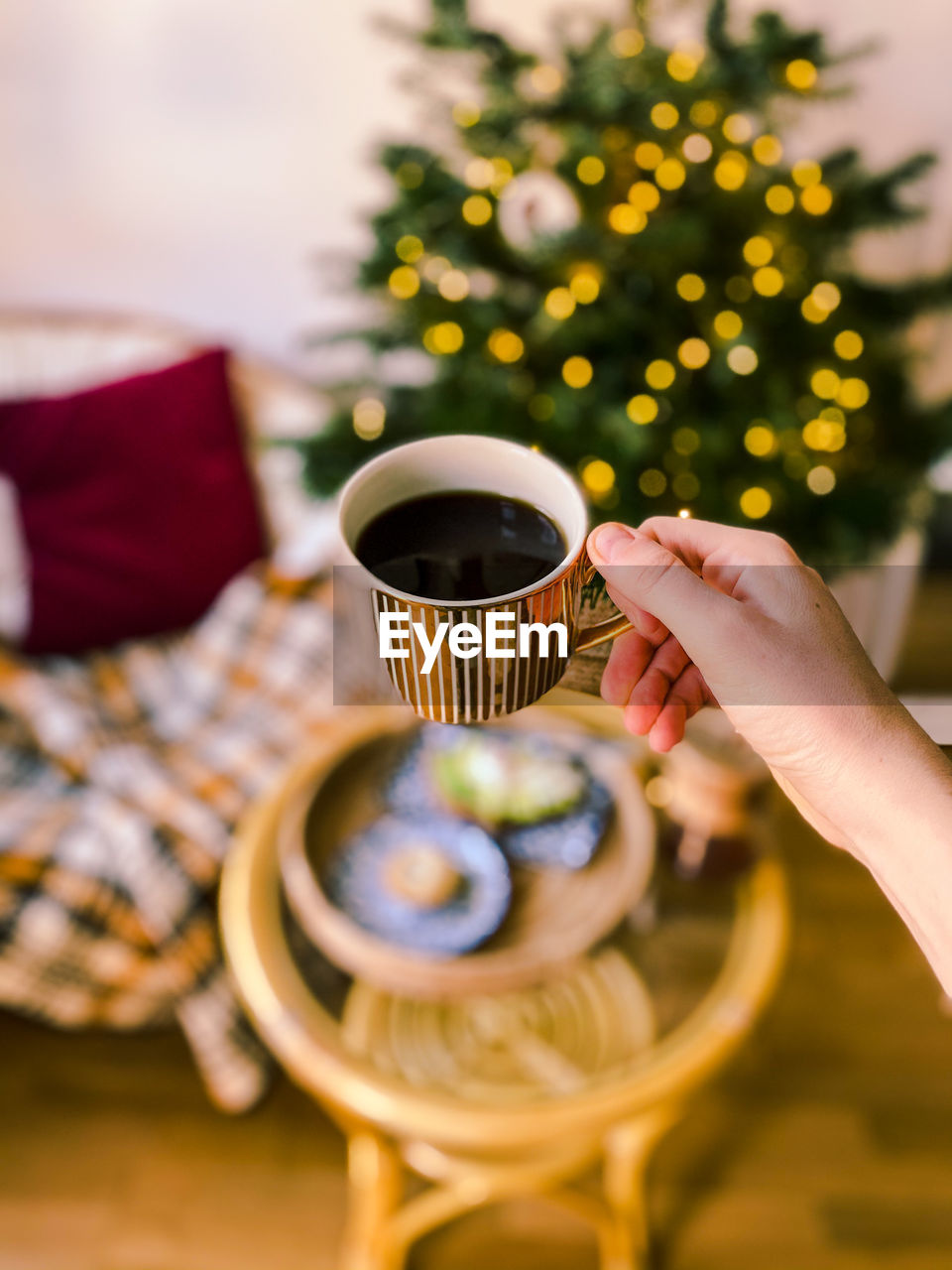 Holding cup of coffee at christmas 