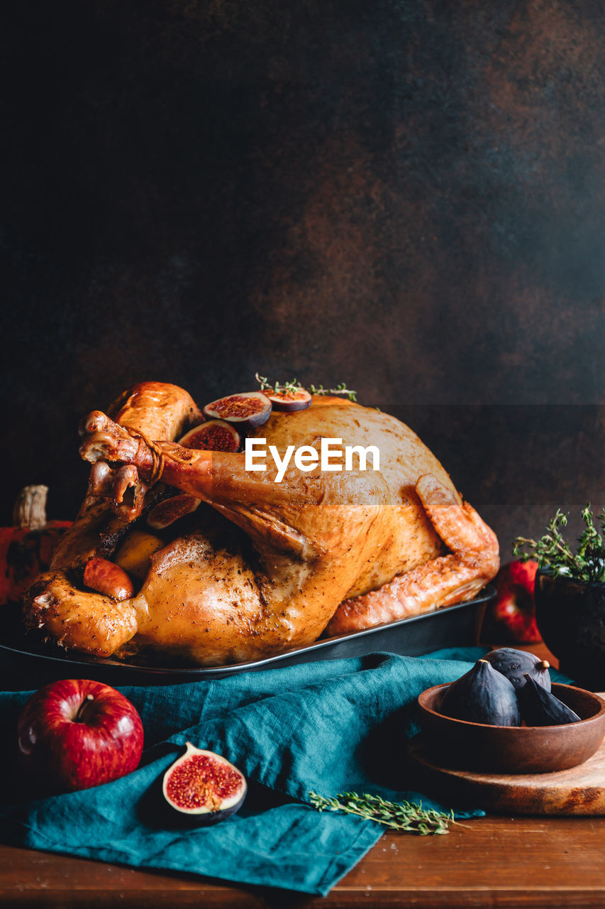 Close-up of roast turkey on table