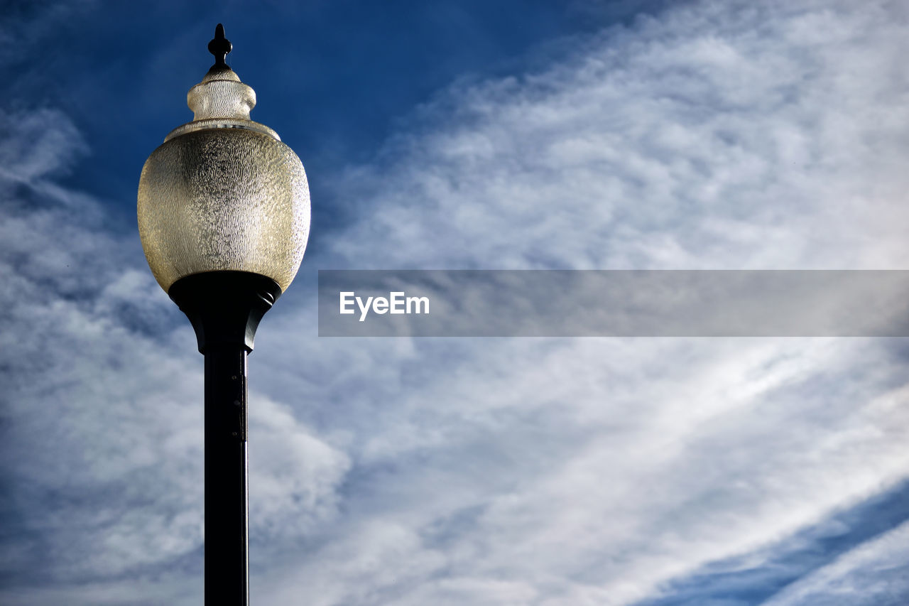 LOW ANGLE VIEW STREET LIGHT AGAINST SKY