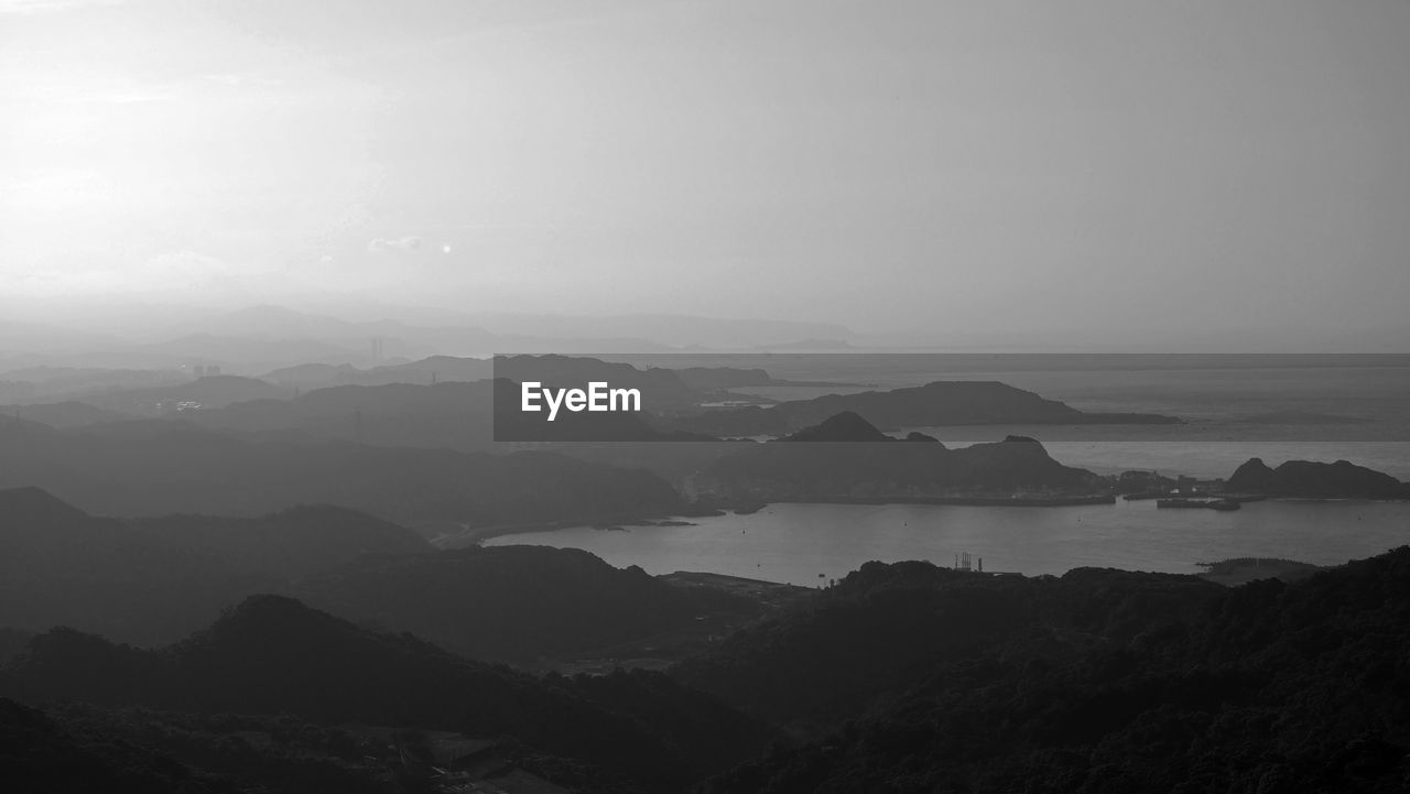 Scenic view of silhouette mountains against sky