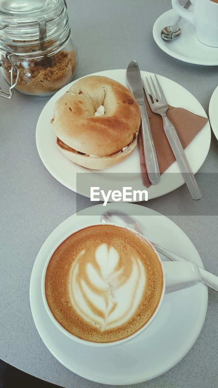 Close-up of coffee served with bread on table