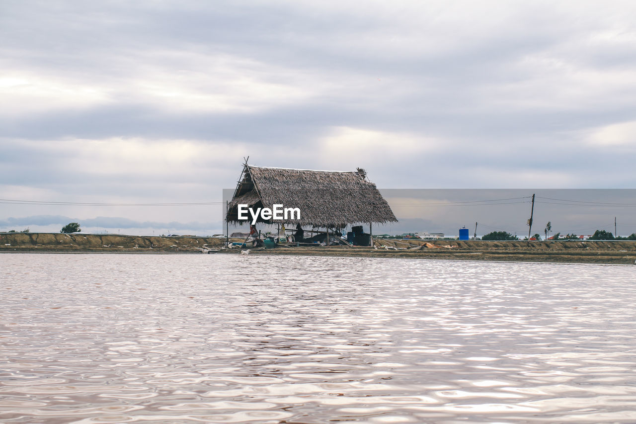 SCENIC VIEW OF LAKE AGAINST BUILDING