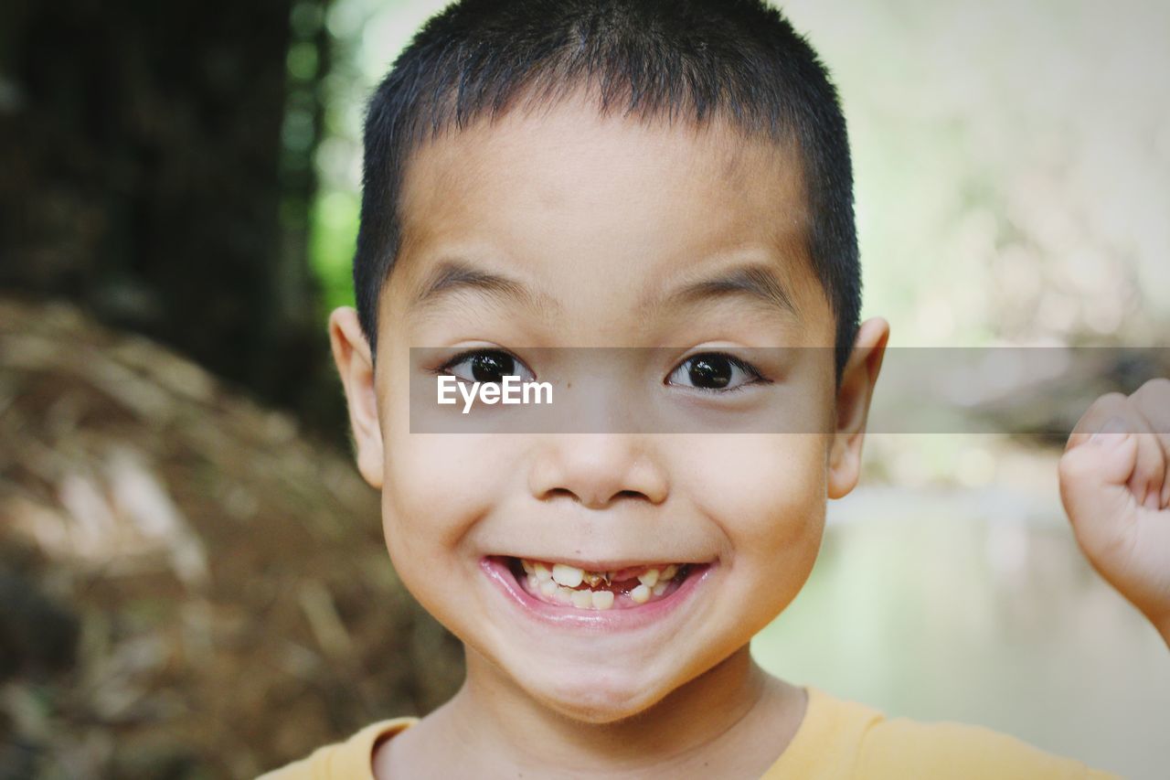 Close-up portrait of smiling boy