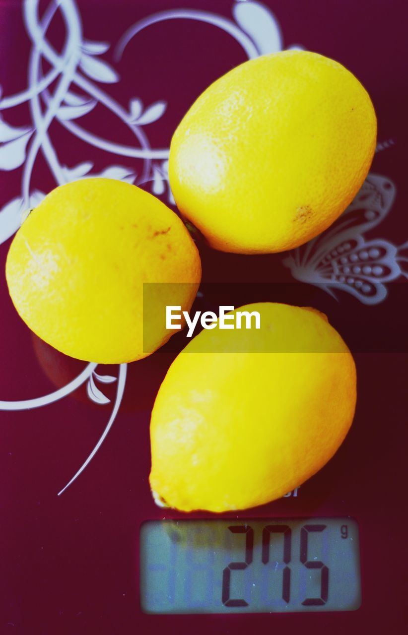 Close-up of lemons on weight scale
