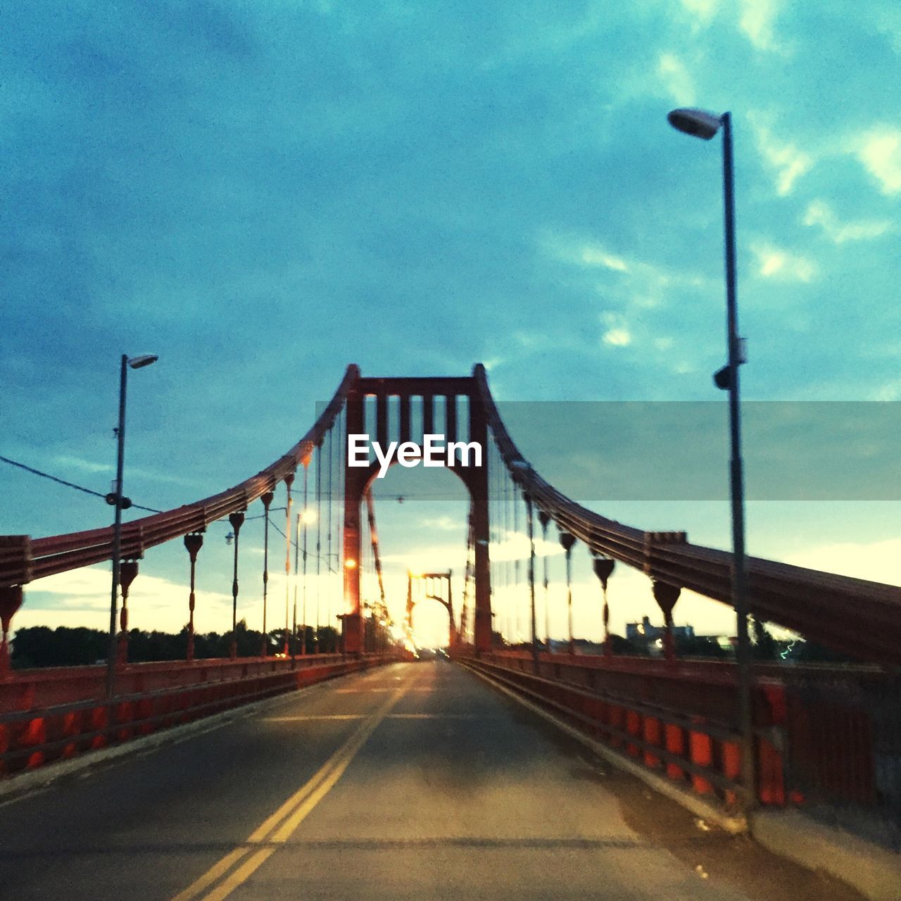 VIEW OF BRIDGE AGAINST CLOUDY SKY