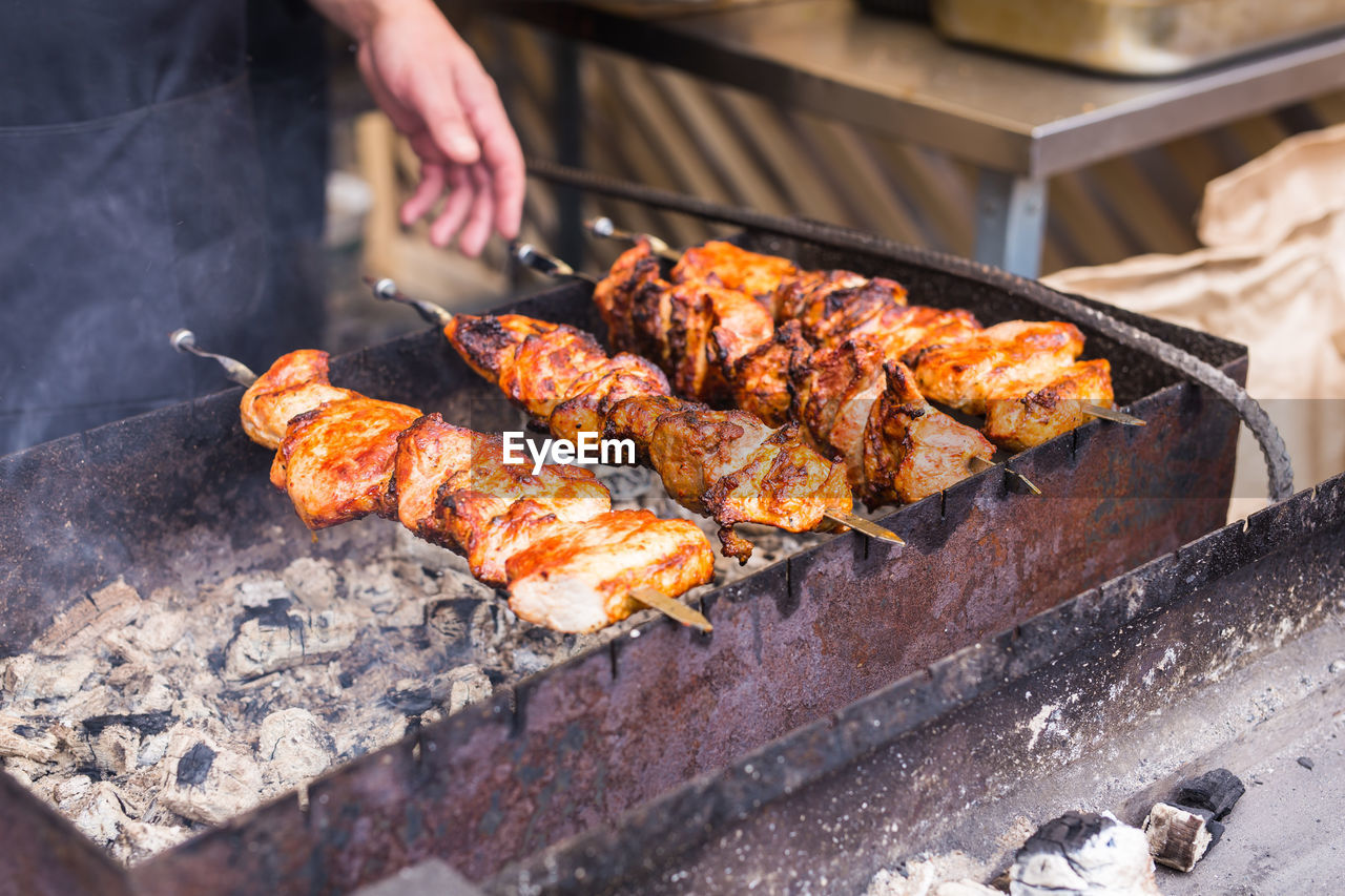 MEAT COOKING ON BARBECUE