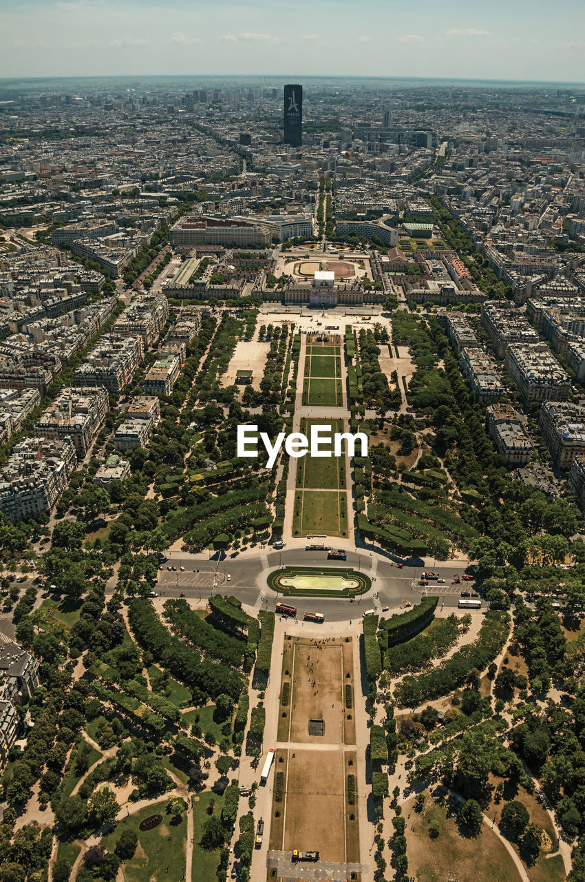 Champ de mars park and cityscape seen from the eiffel tower in paris. the famous capital of france.