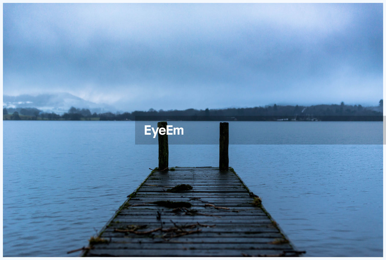 PIER ON JETTY AGAINST LAKE