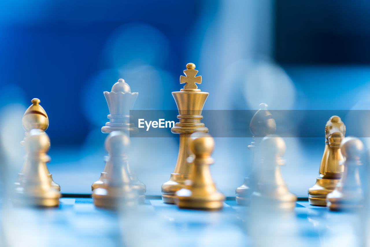 Close-up of chess pieces on board