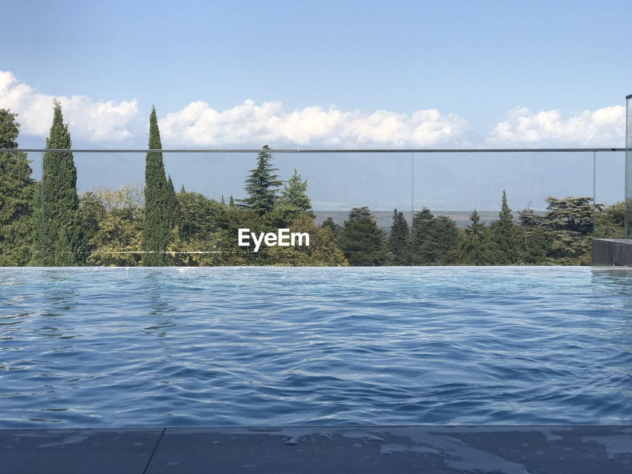 SCENIC VIEW OF SWIMMING POOL AGAINST SKY
