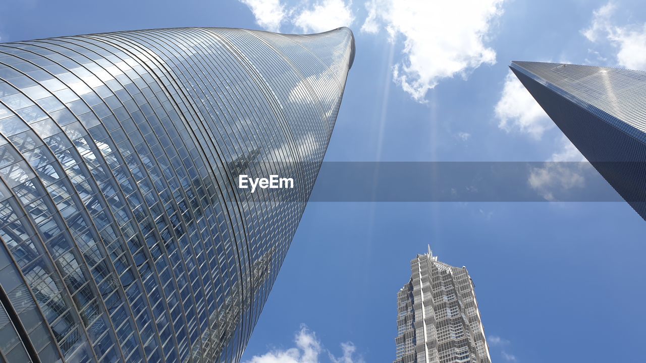 Low angle view of modern buildings against sky