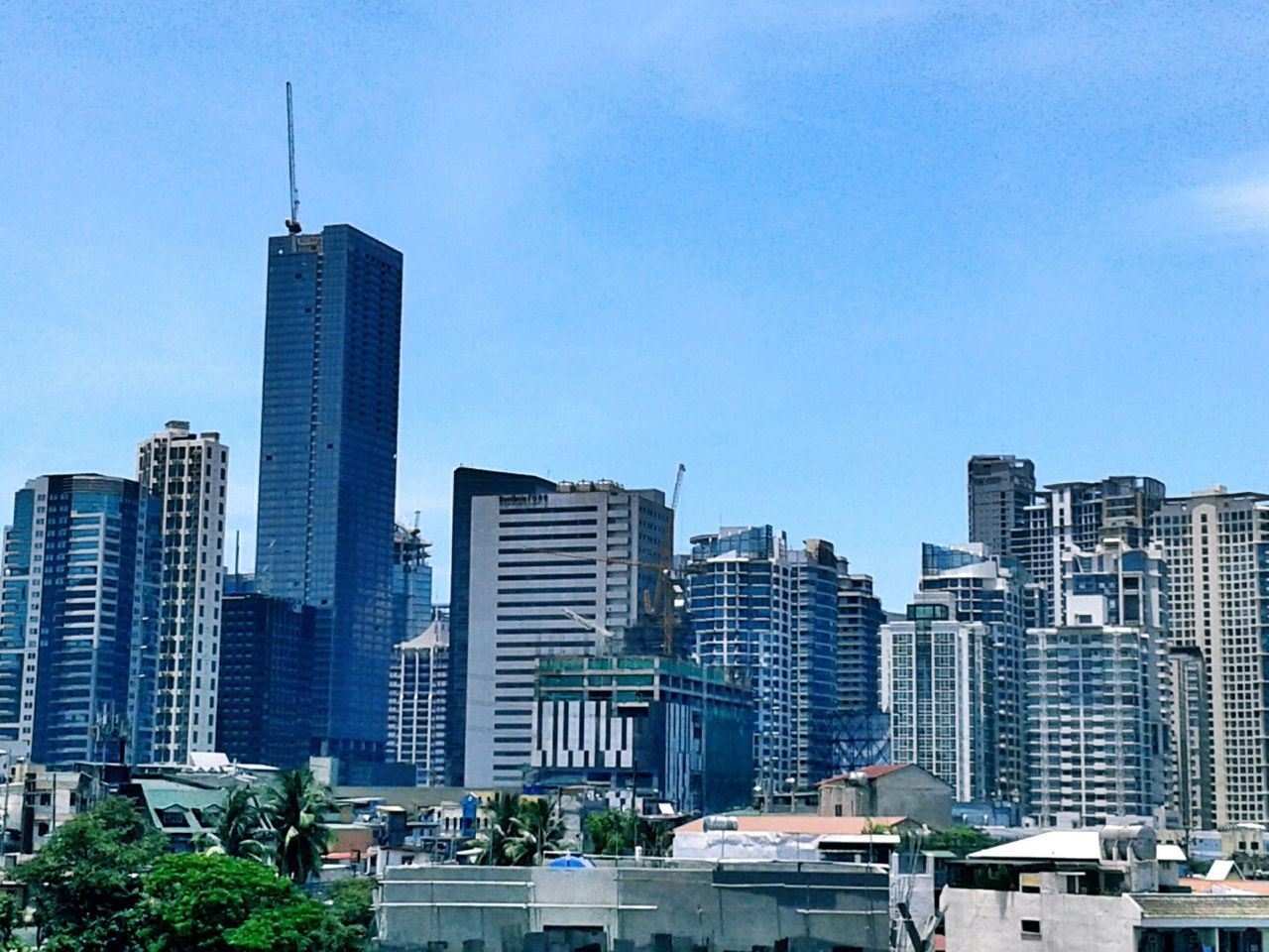 LOW ANGLE VIEW OF MODERN BUILDINGS AGAINST SKY