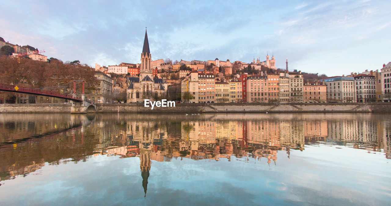 Old lyon and the saint-georges district seen from the edge of the saône at dawn