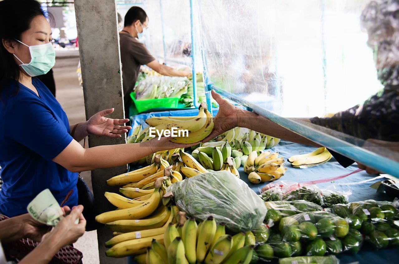 People having food at market stall