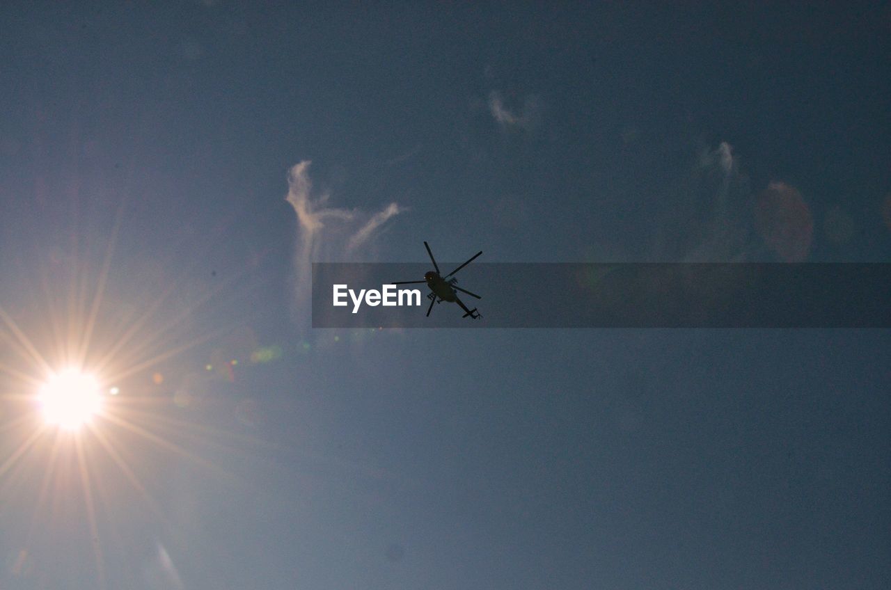 LOW ANGLE VIEW OF AIRPLANE IN SKY