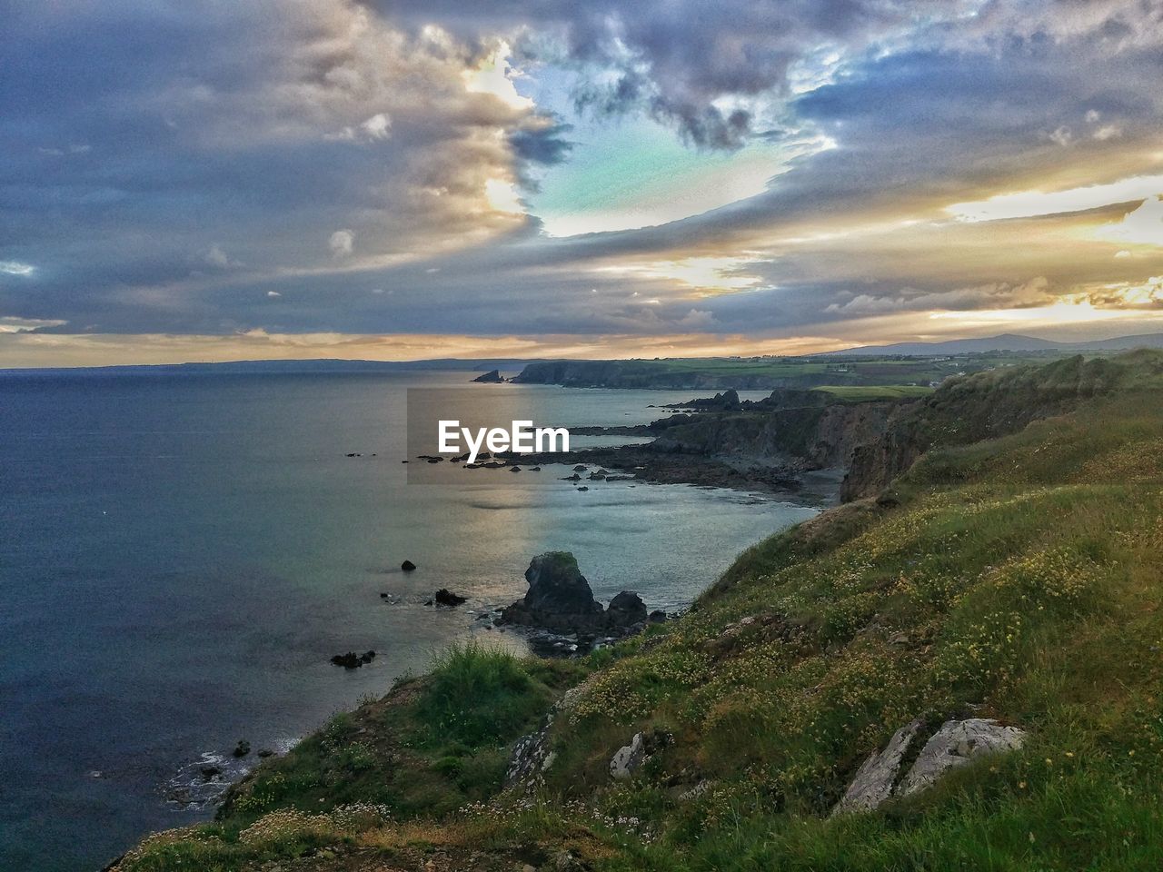 Scenic view of sea against cloudy sky