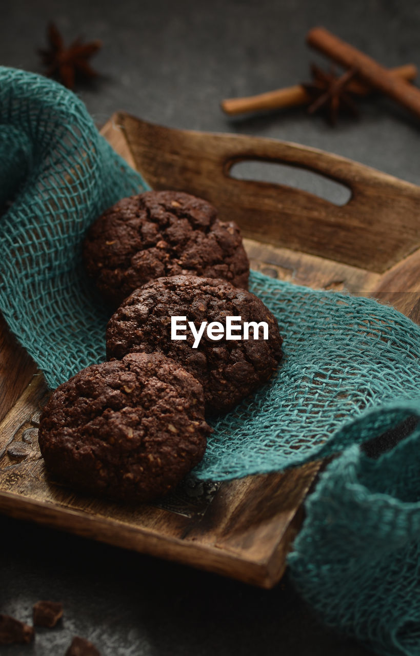 High angle view of chocolate cookies in wooden container