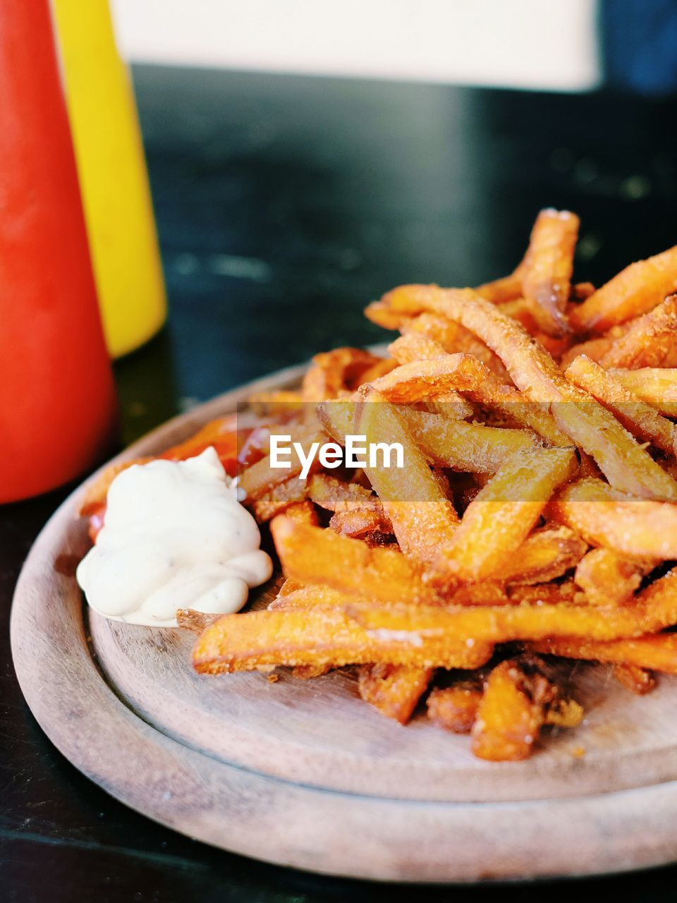Close-up of sweet potatoes fries in plate on field