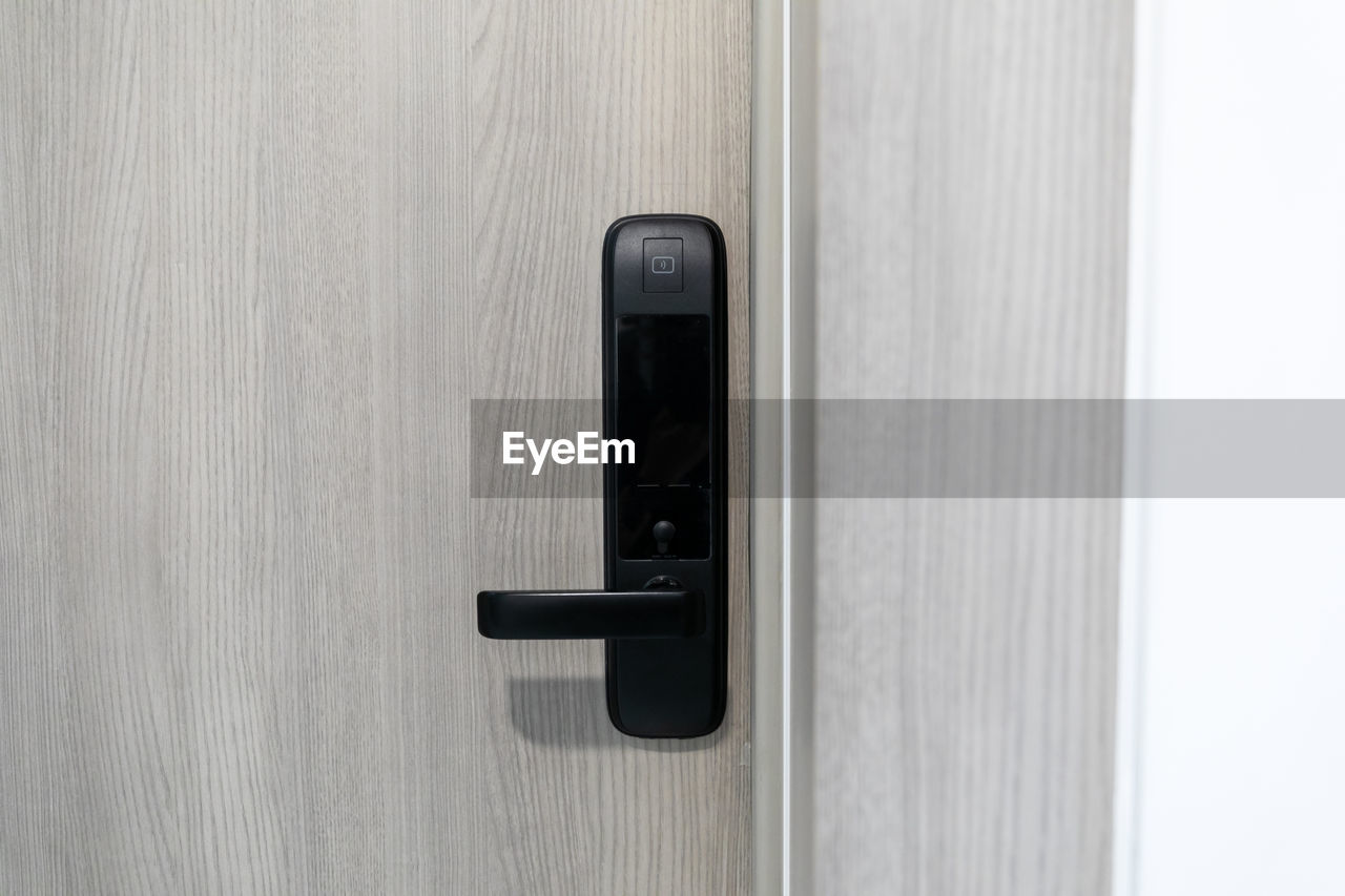 door, entrance, technology, security, communication, indoors, door handle, no people, protection, lock, doorknob, wood, close-up, wireless technology, copy space