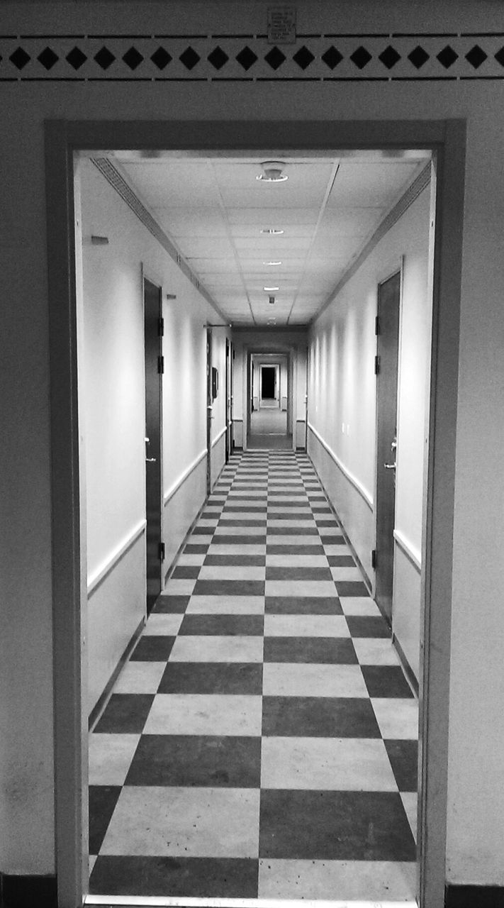 Checked pattern floor on empty corridor