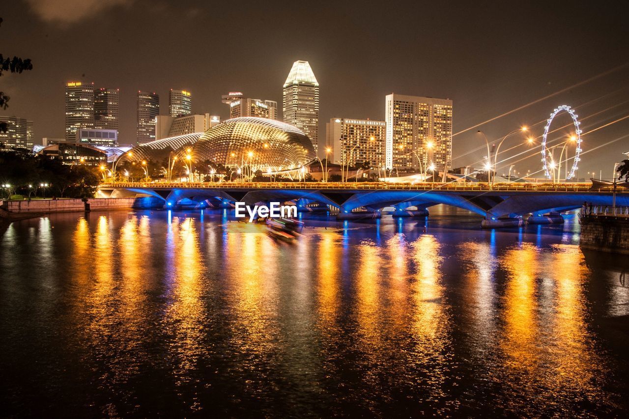 ILLUMINATED BRIDGE OVER RIVER