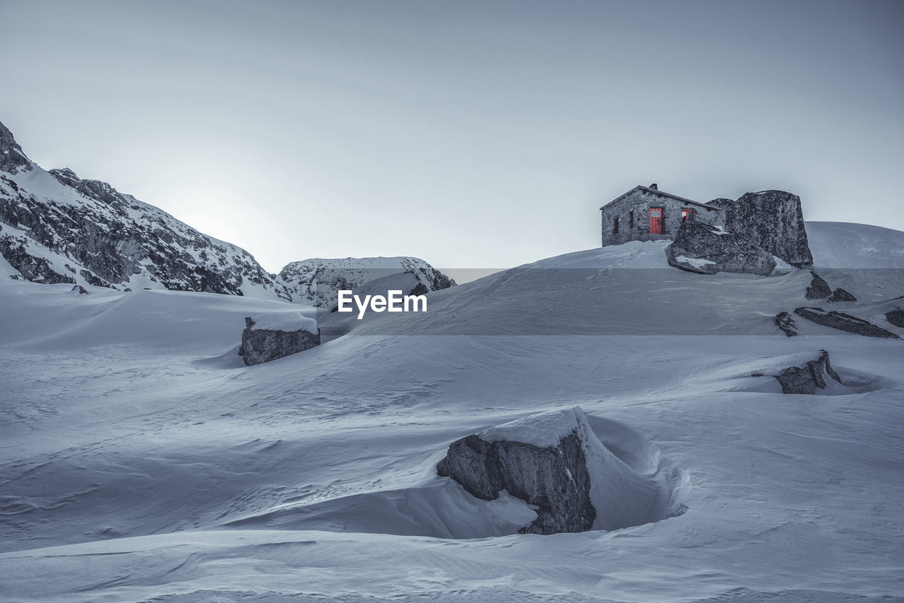 Scenic view of snowcapped mountain against clear sky