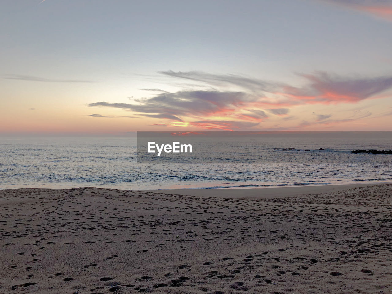 Scenic view of sea against sky during sunset