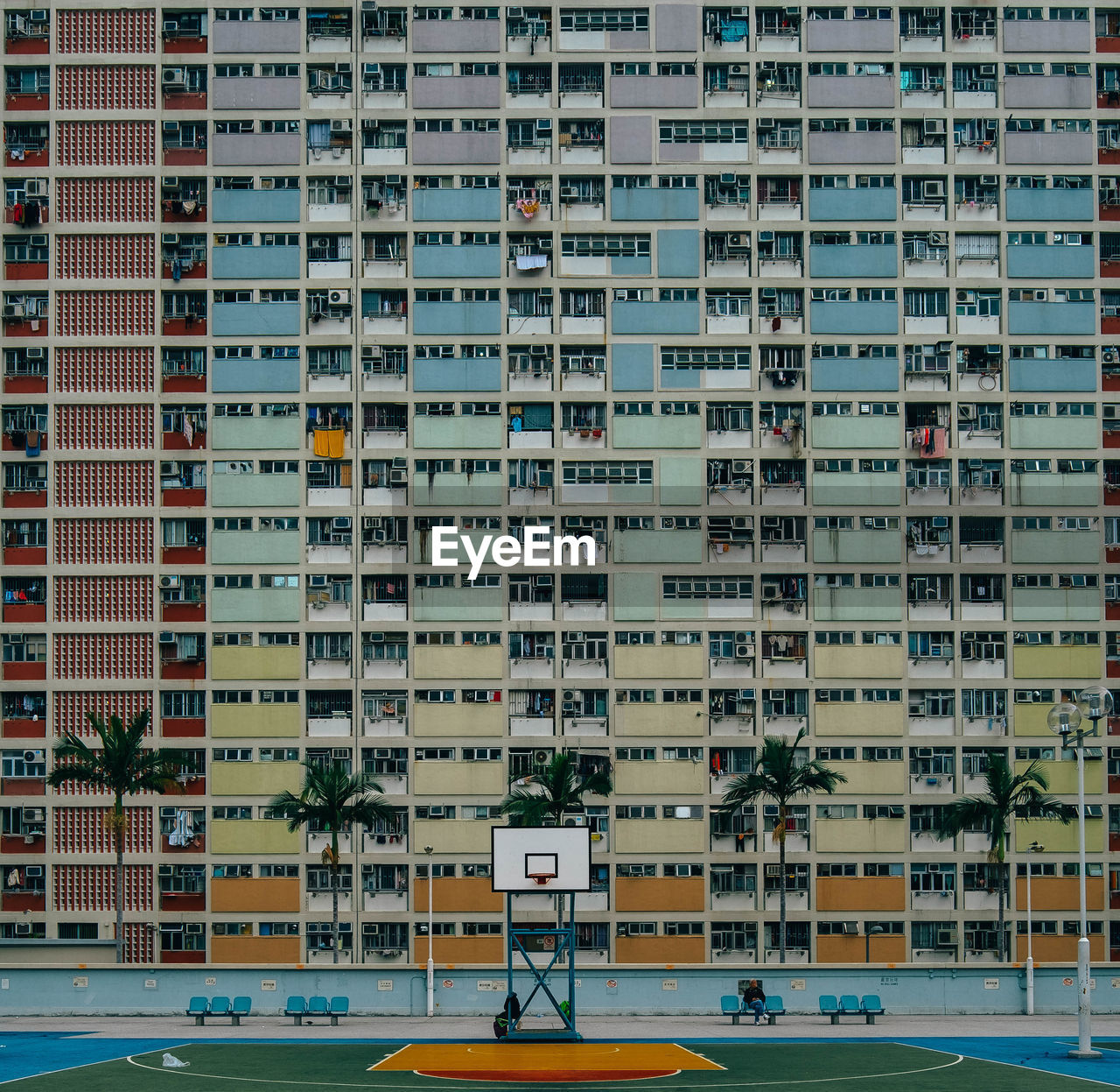 Basketball court against residential building