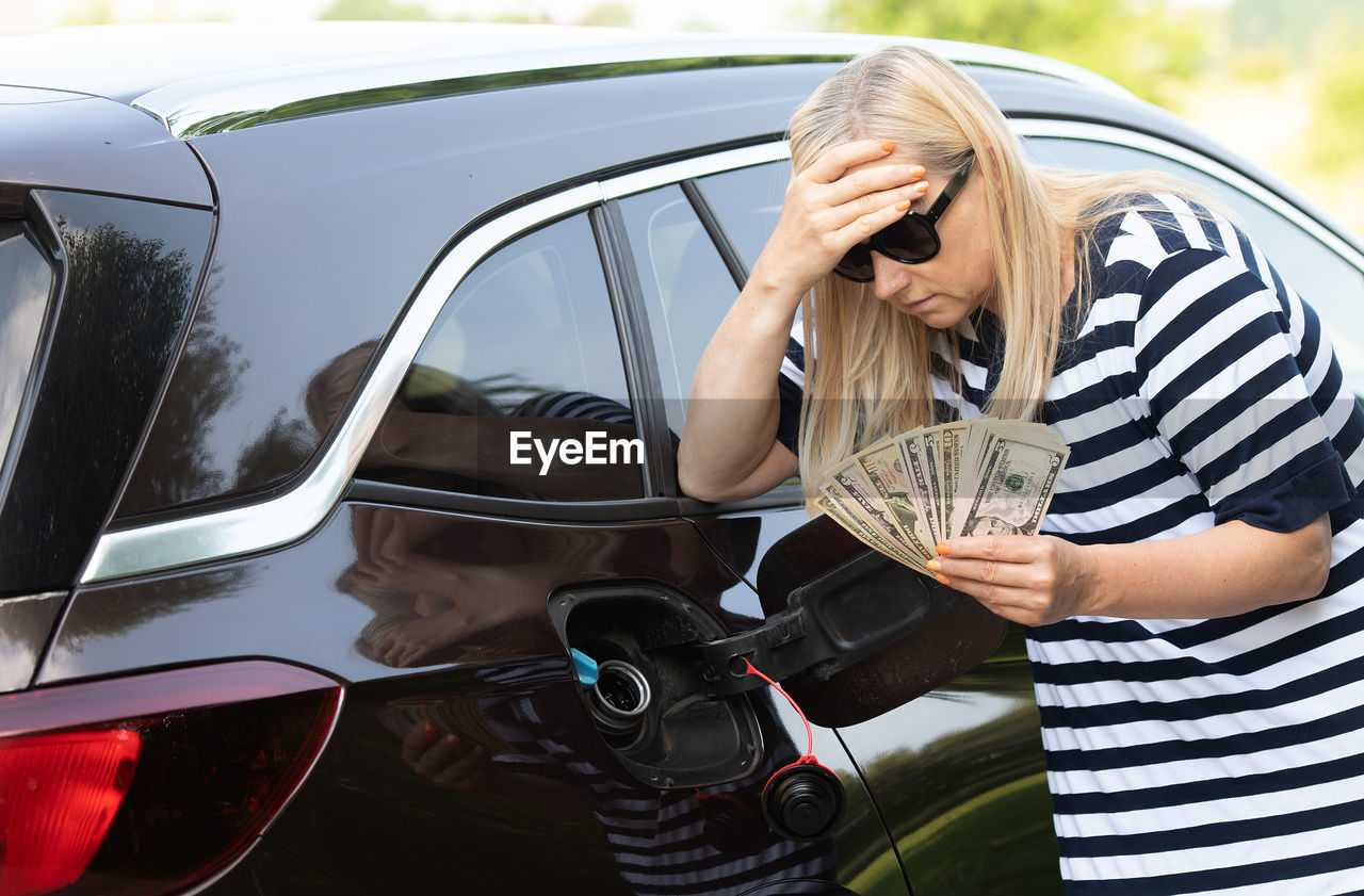 side view of young woman looking through windshield