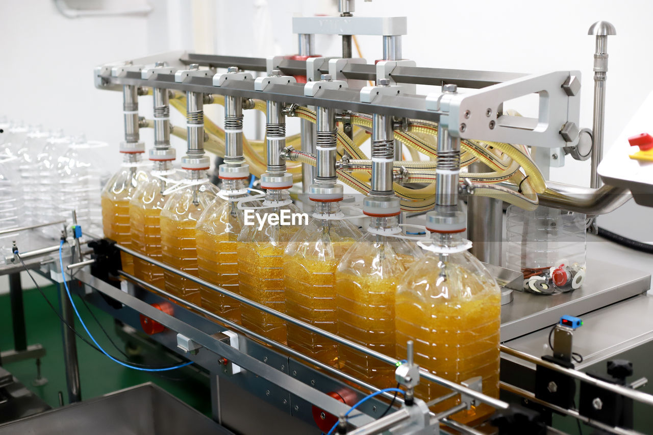 Bottling line of palm oil in bottles. 