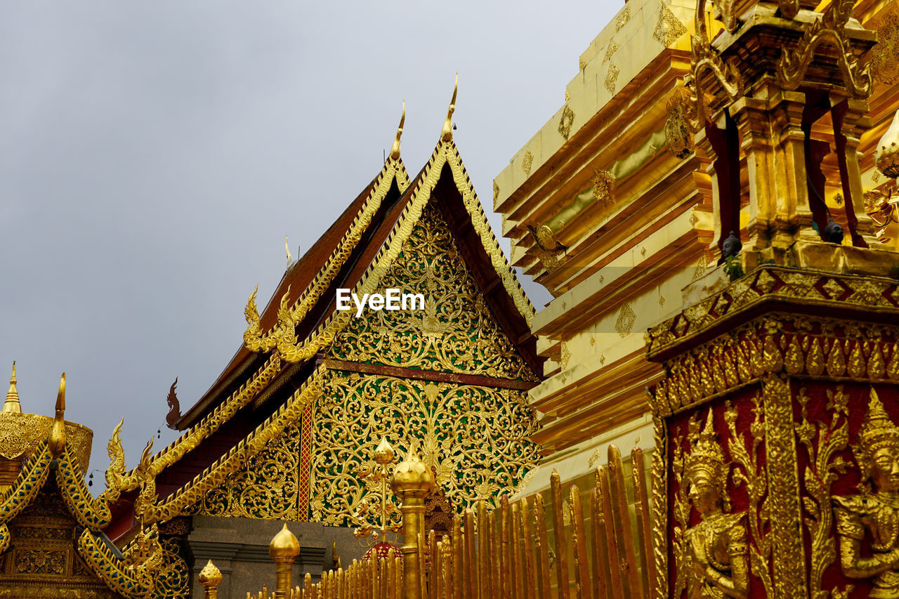 LOW ANGLE VIEW OF TEMPLE AGAINST BUILDING