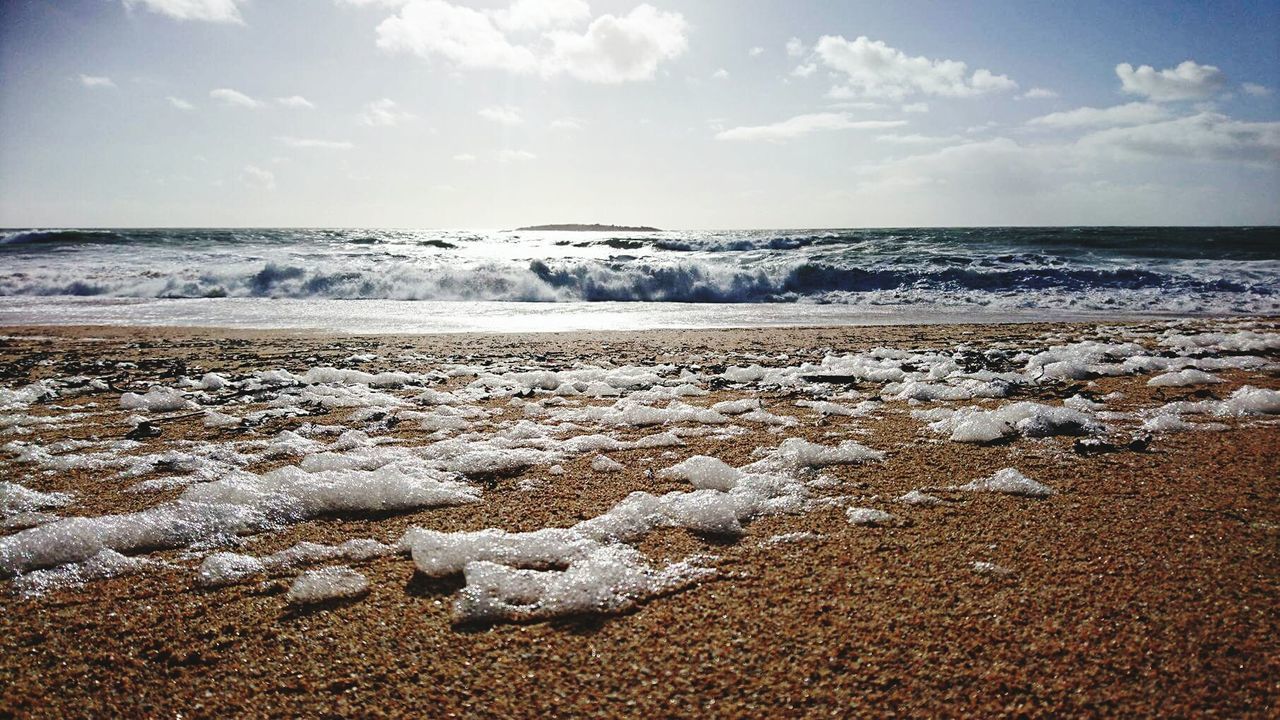 Scenic view of sea against sky during winter