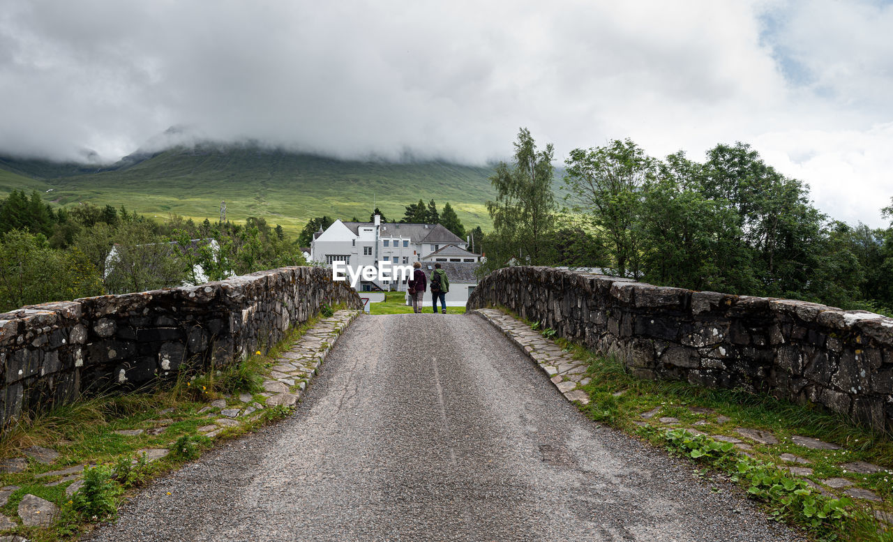 Unrecognised people walking at the bridge of orchy in the central highlands of scotland