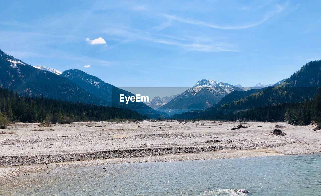 Scenic view of landscape and mountains against sky