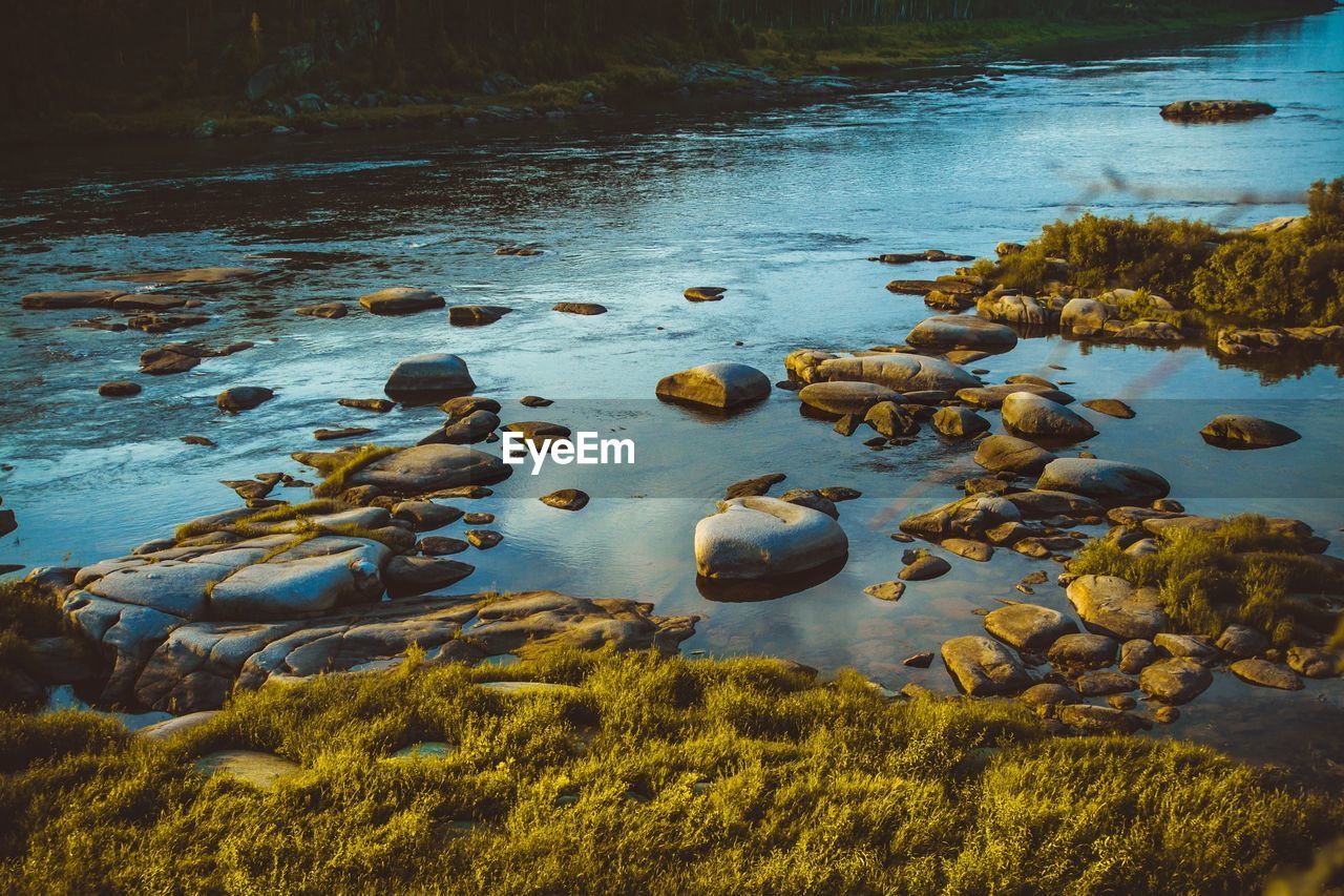 Scenic view of rocks in lake