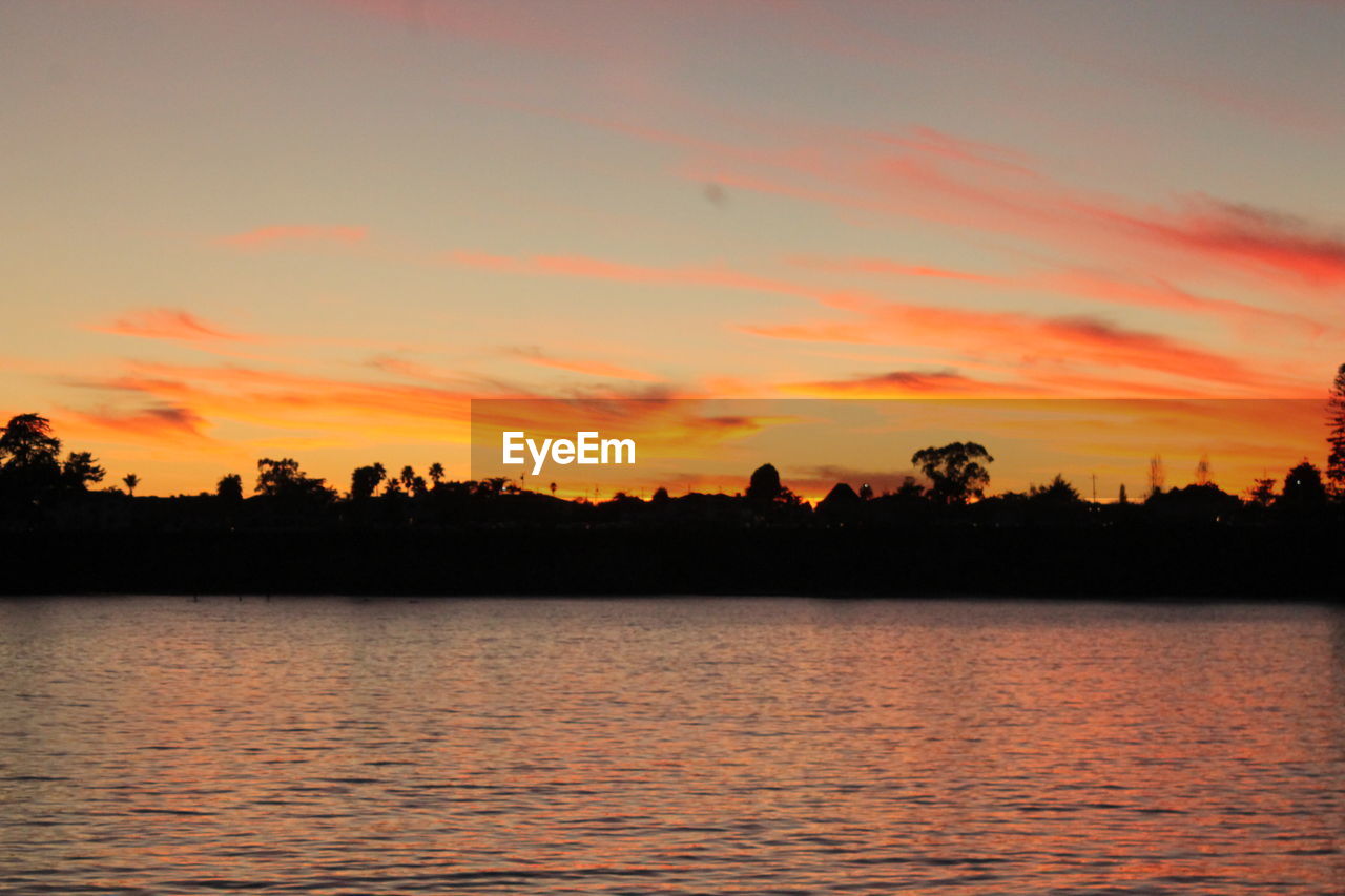 SCENIC VIEW OF LAKE AGAINST ROMANTIC SKY