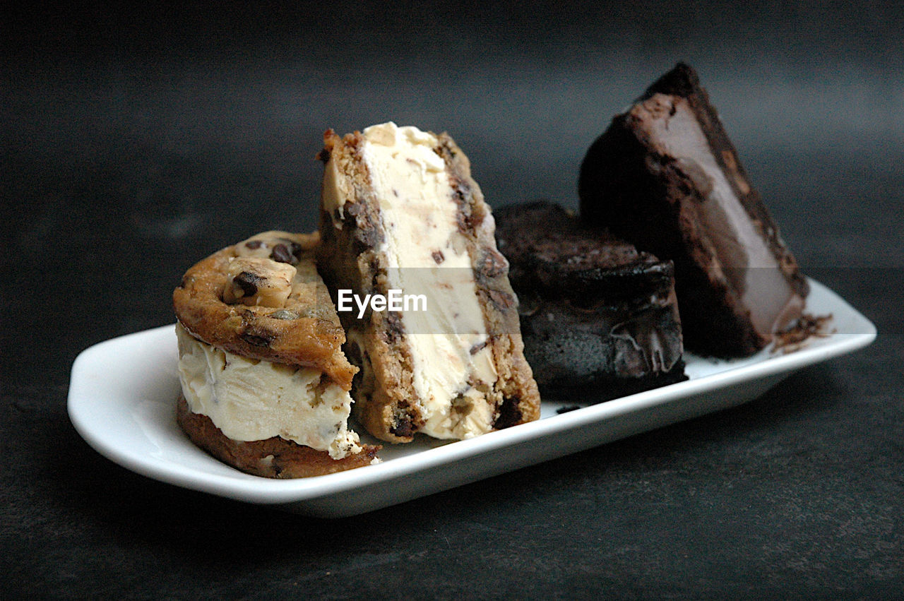 Close-up of ice cream cookie sandwiches in plate on table